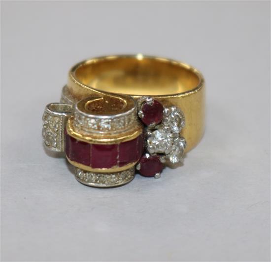 A 1950s? yellow metal, ruby and diamond cocktail ring, size I.